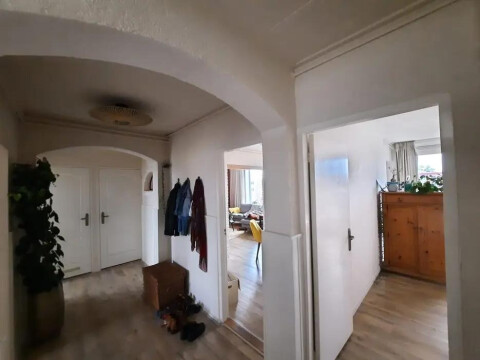 The hallway with built-in closets